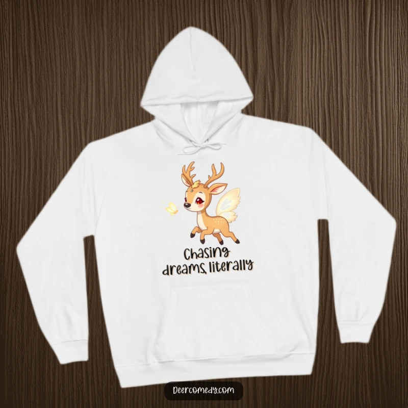 Funny hoodie depicting a gleeful deer enthusiastically pursuing a radiant butterfly composed entirely of shimmering light, celebrating playful wonder.