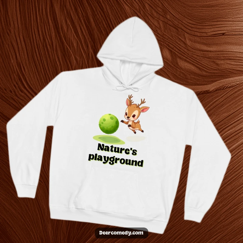 Funny hoodie showing a little deer enthusiastically chasing a bouncy ball made from natural, green moss.