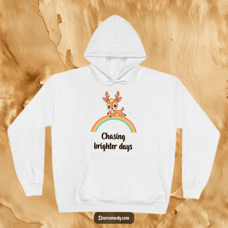 Funny kawaii deer hoodie featuring a deer with sparkling eyes, playfully jumping over a magical rainbow.